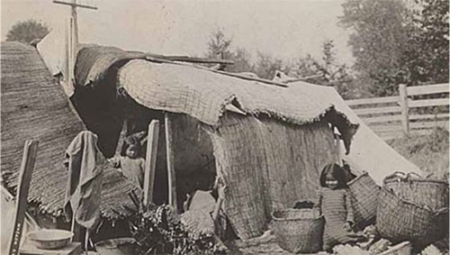 Native American children near shelter