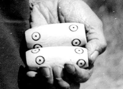 Suquamish game pieces made from decorated deer bone, Washington, 1947